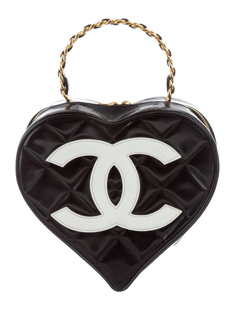 chanel black quilted heart bag|Chanel black bag price.